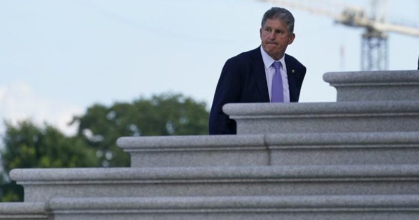 Democratic Sen. Joe Manchin of West Virginia walks up the steps of Capitol Hill in Washington, D.C., on Monday.