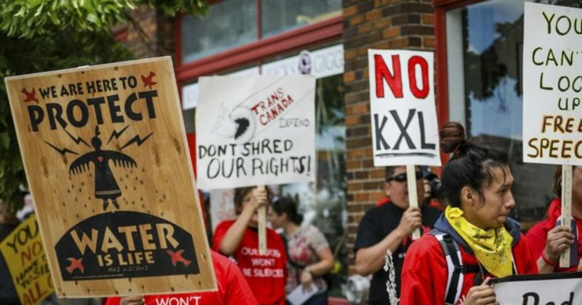 A procession protesting against the Keystone XL pipeline makes its way to Andrew W. Bogue Federal Courthouse in Rapid City, South Dakota, on June 12, 2019.