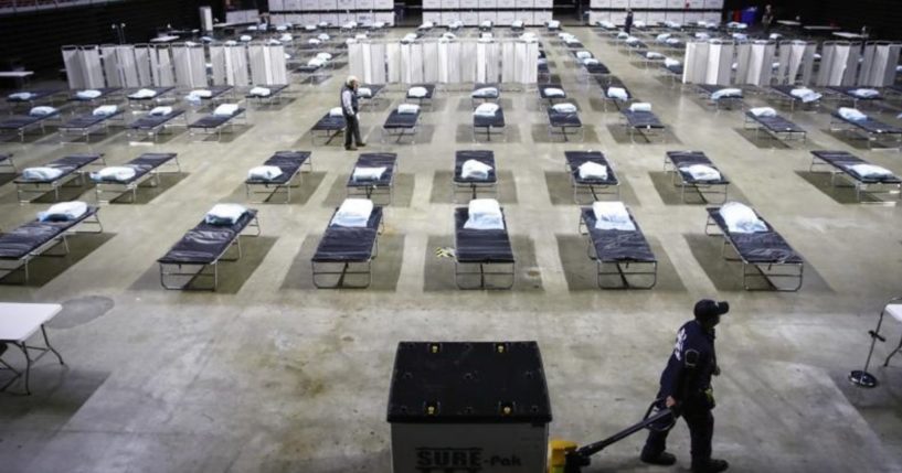 A worker moves items at a Federal Medical Station for hospital surge capacity set up at Temple University's Liacouras Center in Philadelphia on March 30, 2020.