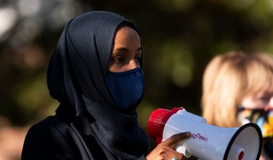 Then-Minnesota Democratic Congressional candidate Ilhan Omar, joined by then-Democratic Senate candidate Tina Smith, speaks during a get out the vote event on the University of Minnesota on Nov. 3, 2020, in Minneapolis, Minnesota.