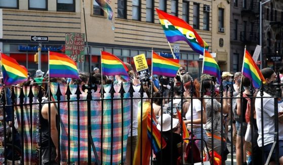 Marchers congregate in front of the Stonewall Inn during the Queer Liberation March for Black Lives & Against Police Brutality on June 28, 2020.