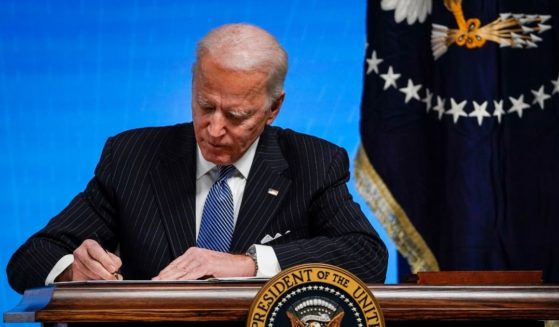 President Joe Biden signs an executive order related to American manufacturing in the South Court Auditorium of the White House complex on Jan. 25, in Washington, D.C.