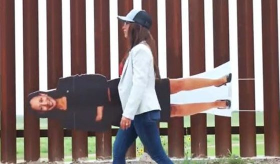 Colorado Republican Rep. Lauren Boebert carries a cutout of Vice President Kamala Harris along the U.S.-Mexican border in a Twitter video released on June 8.