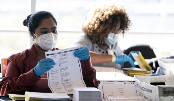 Election workers count Fulton County ballots at State Farm Arena on Nov. 4, 2020, in Atlanta, Georgia.