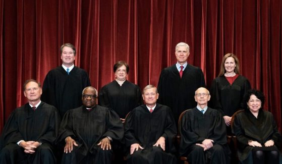 The Supreme Court justices pose during a group photo at the Supreme Court in Washington, D.C., on April 23.