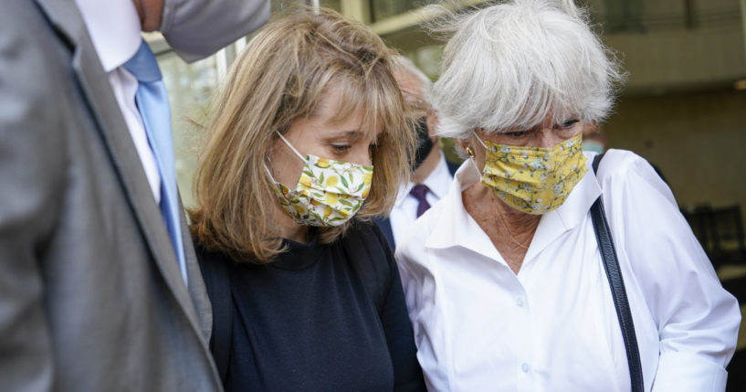 Allison Mack, center, leaves federal court with her mother, Mindy Mack, after being sentenced on Wednesday in New York.