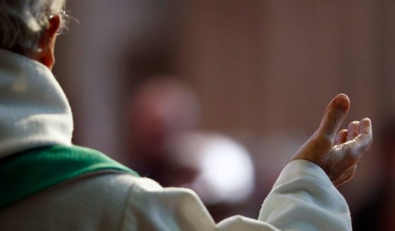 The above stock photo shows a Catholic priest.