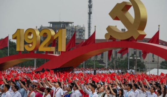 Members of the audience stand and applaud Chinese President and Chairman of the Communist Party Xi Jinping, not seen, during his speech at a ceremony marking the 100th anniversary of the Communist Party at Tiananmen Square on Thursday in Beijing, China.