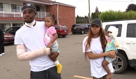 Ray Lucas with his girlfriend, ShiAnn Brown, and their twin daughters, Malaysia and Milan, who were trapped in the basement when the house near Detroit caught fire.