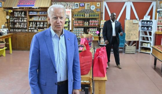 President Joe Biden speaks to reporters in a store in Central Lake, Michigan, on Saturday.