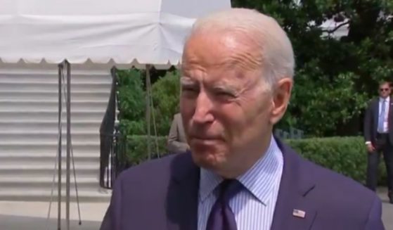 Joe Biden speaks to reporters regarding vaccines