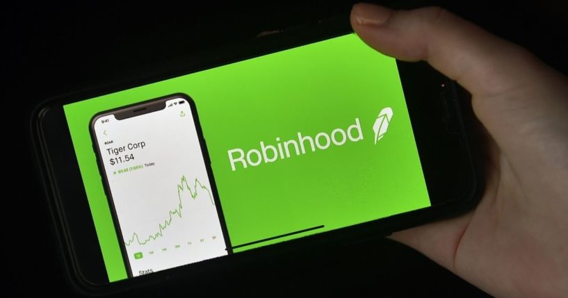 This photo illustration shows the logo of trading application Robinhood on a mobile phone in Arlington, Virginia, on Jan. 28, 2021.