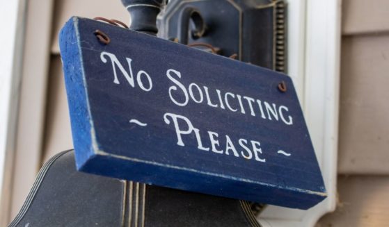 A "no soliciting, please" sign.