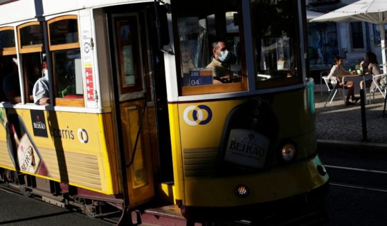 A tram is seen in this Monday photo driving through the Graca neighborhood in the Portuguese city of Lisbon.