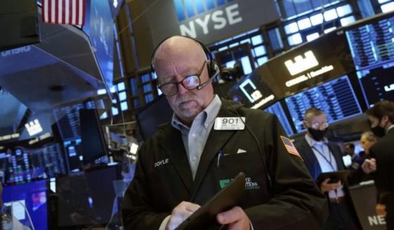 Trader John Doyle works on the floor of the New York Stock Exchange on Friday.