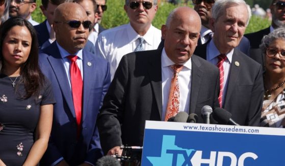 Flanked by Texas state House Democrats, Texas State Rep. Chris Turner, chair of the Texas House Democratic Caucus, speaks as U.S. Rep. Marc Veasey, back row, and U.S. Rep. Lloyd Doggett listen during a news conference outside the U.S. Capitol last week in Washington, D.C.