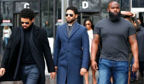 Actor Jussie Smollett, center, leaves Leighton Criminal Courthouse after his court appearance on March 14, 2019, in Chicago.