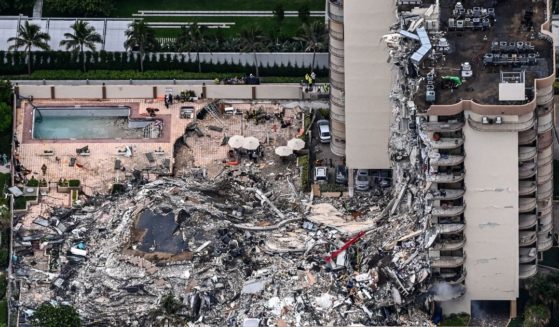 This aerial view shows search and rescue personnel working on site after the partial collapse of the Champlain Towers South in Surfside, north of Miami Beach, on June 24, 2021.