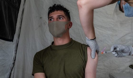 A U.S. Marine receives the Moderna coronavirus vaccine at Camp Foster on April 28, in Ginowan, Japan.