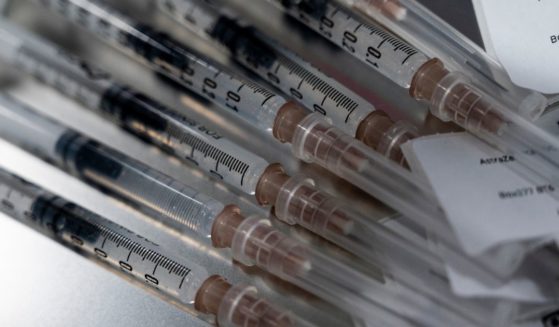 Syringes containing the AstraZeneca coronavirus vaccine sit on a metal tray before being administered to people at Central Vaccination Center in Bang Sue Grand Station on Tuesday in Bangkok.