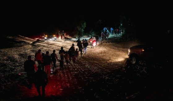 Border Patrol processes a group of migrants in Roma, Texas, after they illegally crossed the Rio Grande on Monday.