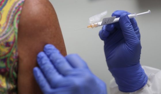 A woman receives a COVID-19 vaccination on Aug. 7, 2020, in Hollywood, Florida.