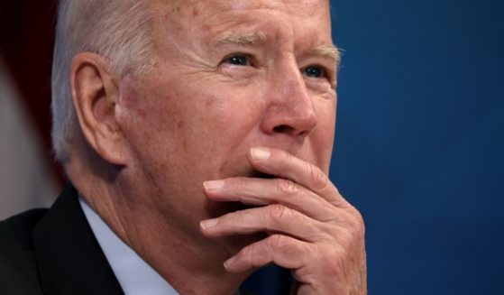 President Joe Biden listens during a meeting in the South Court Auditorium of the Eisenhower Executive Office Building in Washington on Monday.