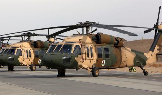 In this 2018 photo, UH-60 Black Hawk helicopters are parked at Kandahar Air Field in Afghanistan.