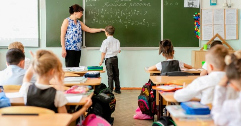 Children are pictured in an elementary school classroom in the stock image above.