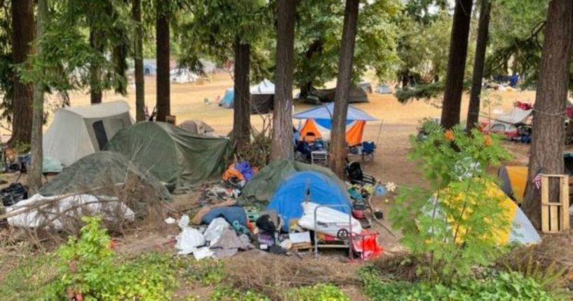 A large encampment for homeless people is seen at the Broadview-Thomson K-8 School in Seattle.