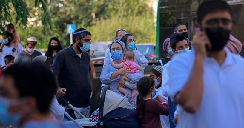 Israelis wait to get a rapid COVID-19 antigenic test at Israel's Magen David Adom medical service in Jerusalem on Aug. 8, 2021.