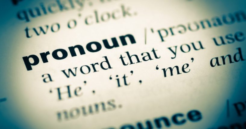 A dictionary entry for the word "pronoun" is pictured in the stock image above.