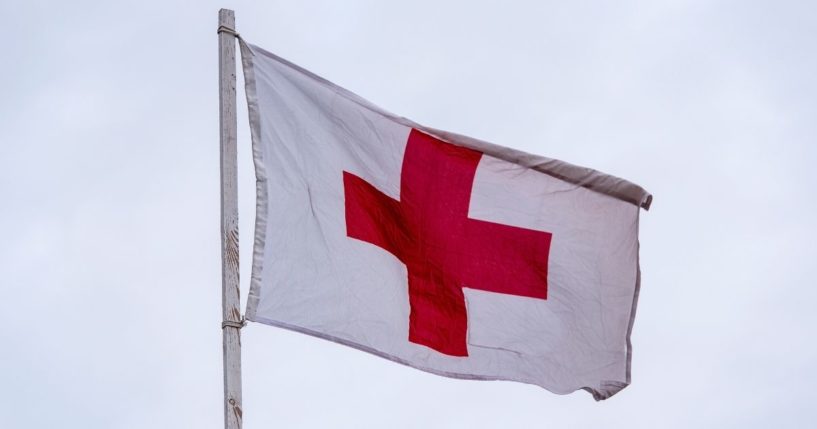 The Red Cross flag is seen in the stock image above.