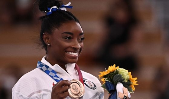 U.S. gymnast Simone Biles poses with her bronze medal during the podium ceremony of the balance beam competition of the Tokyo Olympic Games at the Ariake Gymnastics Centre on Tuesday.