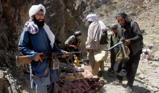 In this May 27, 2016, file, photo, members of a breakaway faction of the Taliban fighters prepare to guard a gathering in the Shindand district of Herat province, Afghanistan.