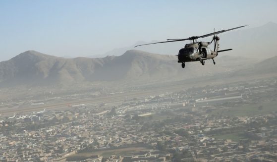 A Black Hawk helicopter flies over the city in Kabul, Afghanistan, on Oct. 3, 2014.