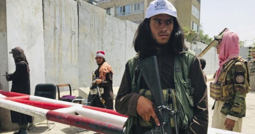 Taliban fighters stand outside a checkpoint in Kabul, Afghanistan, on Tuesday.