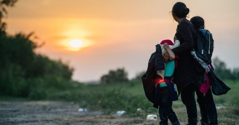 Migrants stand in La Joya, Texas, after crossing the border from Mexico on June 21.