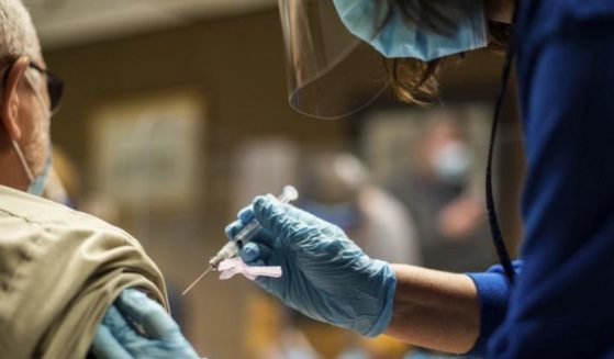 Tyson Foods employees receive the COVID-19 vaccine at a facility in Wilkesboro, North Carolina, on Feb. 2.