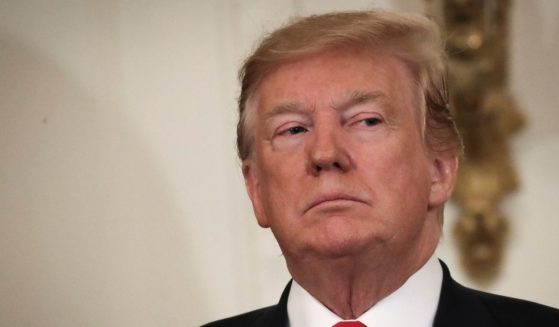 Then-President Donald Trump looks on during an event recognizing the Wounded Warrior Project Soldier Ride in the East Room of the White House, April 18, 2019, in Washington, D.C.