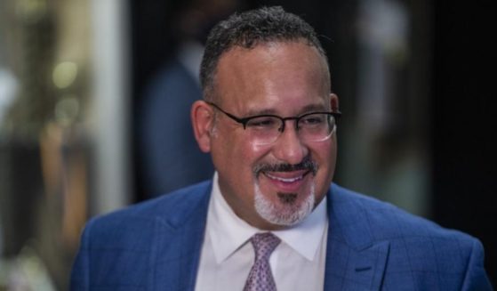 Education Secretary Miguel Cardona is seen speaking to the media after visiting P.S. 5 Port Morris in the Bronx in New York on Aug. 17, 2021.