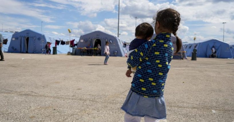 Afghan refugees are seen at an Italian Red Cross camp in Avezzano, Italy, on Tuesday.