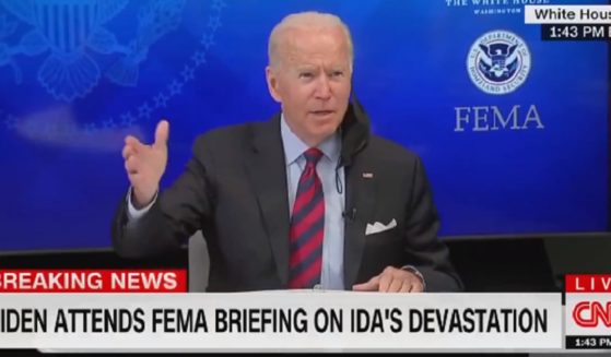 President Joe Biden gestures Monday while introducting senior advisor Cedric Richmond at a news conference.