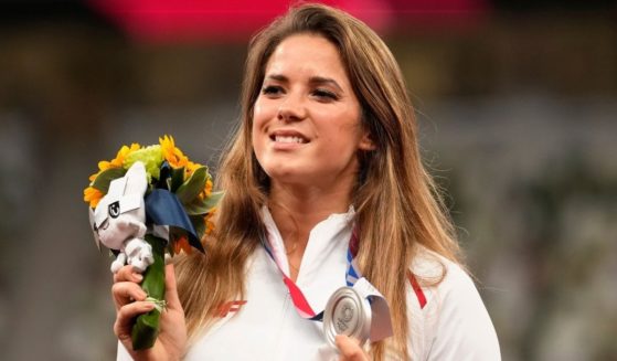 Silver medalist Maria Andrejczyk of Poland poses on the podium during the medal ceremony for the women's javelin at the Tokyo Olympics on Aug. 7, 2021, in Tokyo.