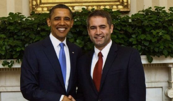 Former President Barack Obama, left, and Minnesota elementary school principal Ryan Vernosh, right.