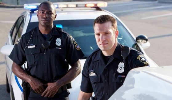 Police officers are seen in the above stock image.