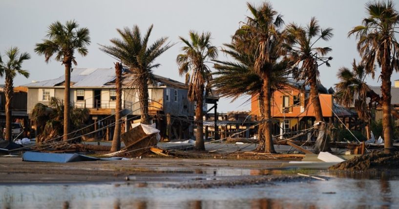 Storm debris litters a neighborhood in the wake of Hurricane Ida on Sept. 3, 2021, in Grand Isle, Louisiana.