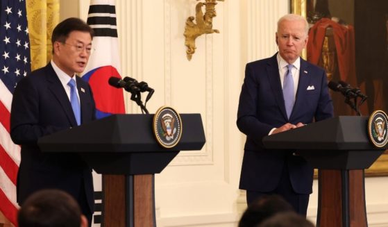 President Joe Biden, right, listens as South Korean President Moon Jae-in speaks at a joint news conference in the East Room of the White House on May 21, 2021, in Washington, D.C.