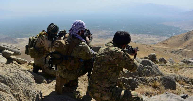 Anti-Taliban forces patrol on a hilltop in Panjshir province, Afghanistan, on Wednesday.