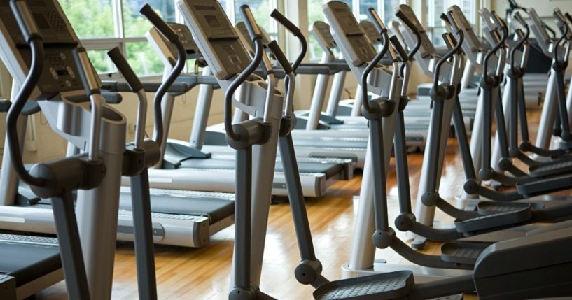 Rows of treadmills are pictured in the stock image above.